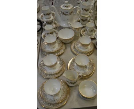 A Royal Standard coffee service for six, comprising of cream jug, cups and saucers, coffee pot; a Royal Stafford part tea ser