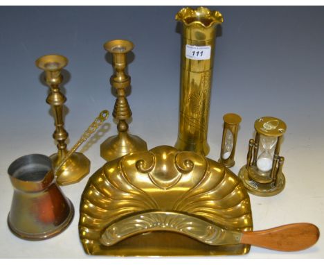 Brassware - a brass trench art vase; an early 20th Century brass beehive candlestick; a brass crumb tray and brush; brass egg