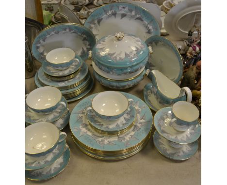 A Wedgwood part dinner service, printed with silver coloured Ivy leaves on a turquoise ground, gilt rim, comprising of tureen