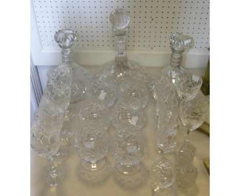 Glassware - a cut glass Ships decanter; a pair of cut glass decanters mushroom stoppers; cut glass champagne flutes; brandy g