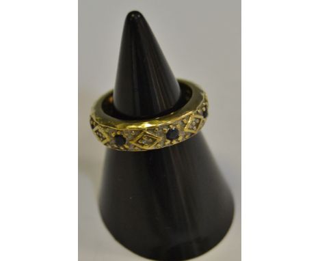A diamond and sapphire eternity ring, unmarked yellow metal, 3.3g gross