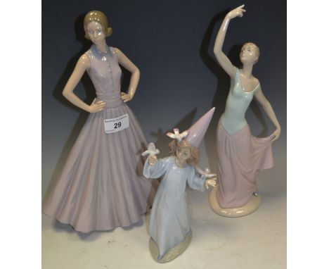 Decorative Ceramics - a Lladro figure of a Girl with Doves; a Nao figure of a Ballerina; another (3)