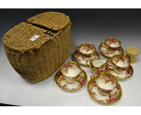 A Royal Chelsea Golden Rose tea service, comprising five cups and saucers, milk jug, printed marks