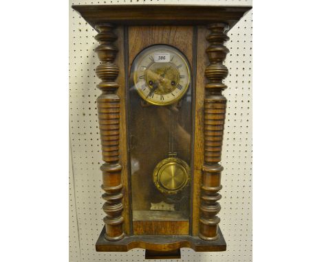 A Victorian drop pendulum wall clock; enamel chapter ring, Roman numerals