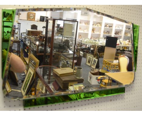 An Art Deco mirror, green glass inclusions 
