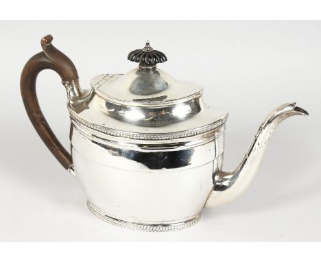 A GEORGE III OVAL TEAPOT, with ebony finial and handle. London 1803.  Maker: Daniel Piers.