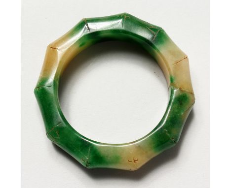 A CARVED JADE BAMBOO FORM BANGLE. 3.25ins diameter.