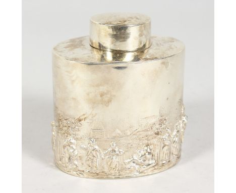 AN OVAL TEA CADDY AND STOPPER, repousse with a Dutch scene. Chester 1902.