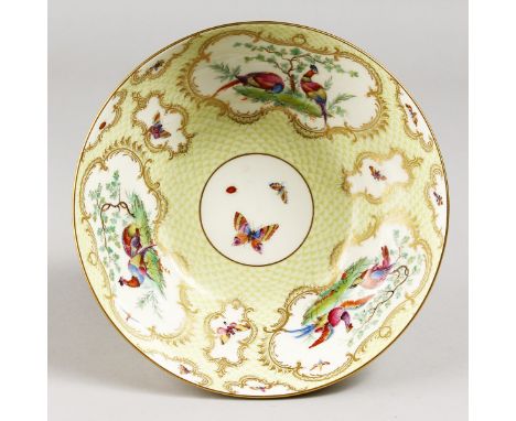 A RARE ROYAL WORCESTER YELLOW SCALE BOWL, painted with birds, signed J. Freeman, date code for 1931.