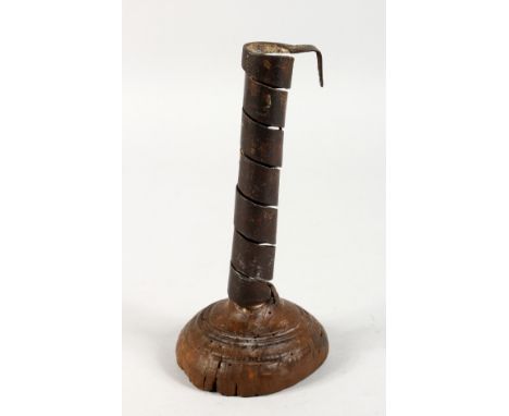 AN EARLY CANDLESTICK. 7.5ins high.