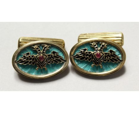 A PAIR OF MODERN RUSSIAN SILVER AND ENAMEL DECORATED DOUBLE EAGLE CUFFLINKS.