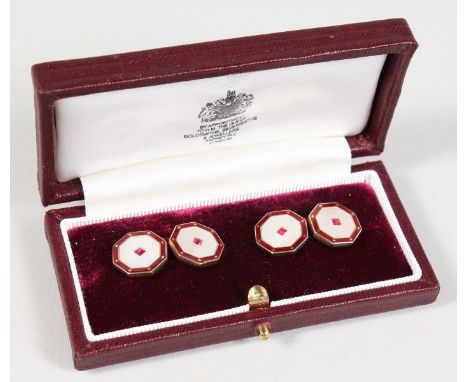 A PAIR OF ASPREY 9CT GOLD, RUBY AND MOTHER-OF-PEARL OCTAGONAL SHAPED CUFFLINKS, in an Asprey leather case.