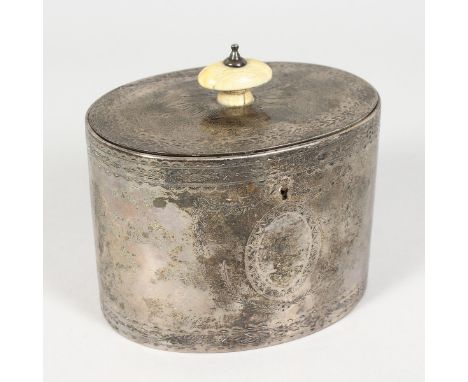 A VICTORIAN OVAL SILVER TEA CADDY, with engraved decoration. London 1857.  Maker: JA.  3.5ins high.