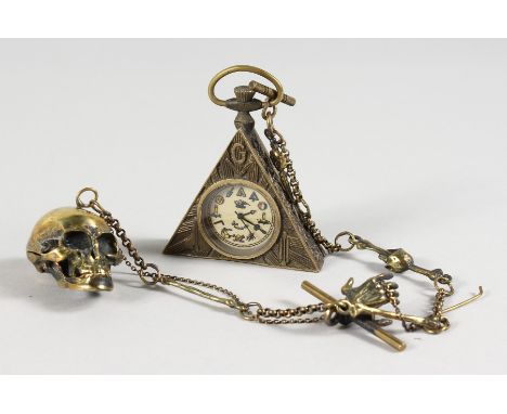 A BRASS MASONIC SKULL WATCH.