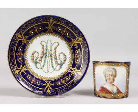 A GOOD SEVRES CUP AND SAUCERS, rich blue ground, portrait of Md. Necker. Mark in blue, Letter K.