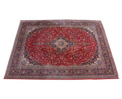 A GOOD LARGE KASHAN CARPET, 20TH CENTURY, claret ground with allover floral decoration. 13ft 0ins x 10ft 0ins.