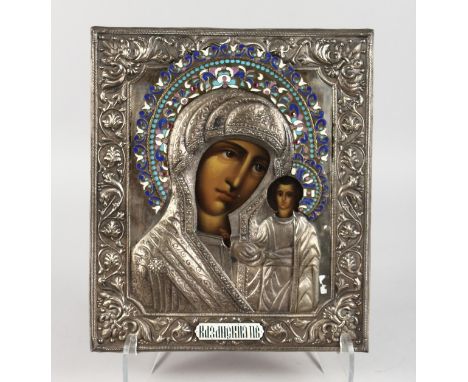 A GOOD RUSSIAN ICON, 20TH CENTURY, painted with the Madonna and Infant Christ, in an elaborate silver and enamel decorated fr