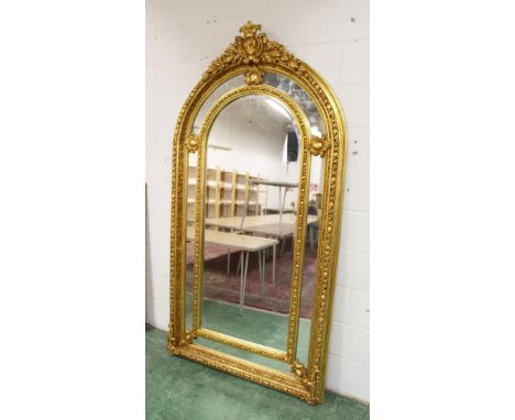 A LARGE IMPRESSIVE GILT FRAMED ARCH TOP MIRROR. 7ft 4ins high x 3ft 10ins wide.
