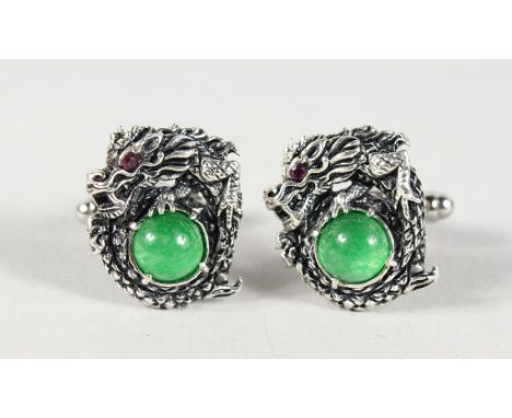A PAIR OF SILVER AND JADE DRAGON CUFFLINKS.