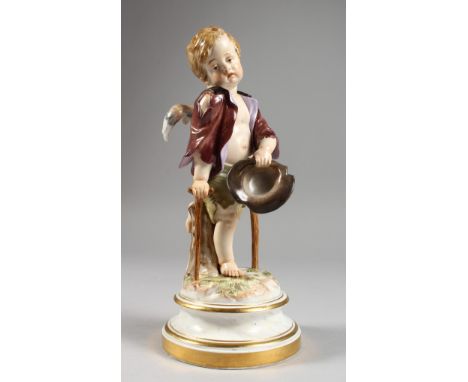 A MEISSEN PORCELAIN FIGURE OF A CHERUB holding a hat and walking with a stick. Cross swords mark in blue.  Impressed No. 138.