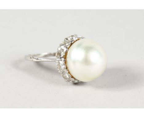 AN 18CT WHITE GOLD, BAROQUE PEARL AND DIAMOND RING.