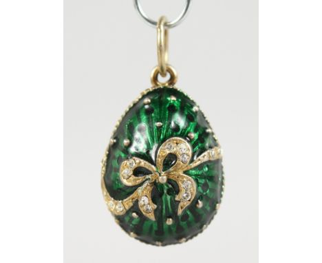 A SMALL RUSSIAN SILVER AND ENAMEL EGG SHAPE PENDANT.
