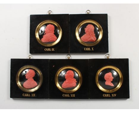 A SET OF FIVE WAX PORTRAIT MINIATURES OF CARL IX, CARL X, CARL XII, CARL XIII AND CARL CARL IV. 3ins diameter, framed and gla