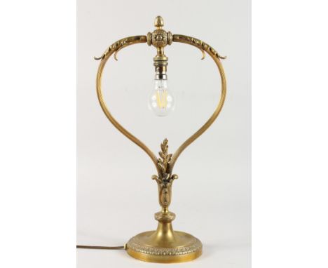 A GOOD FRENCH ORMOLU TABLE LAMP, with acanthus and pineapple finial on a circular base. 20ins high.