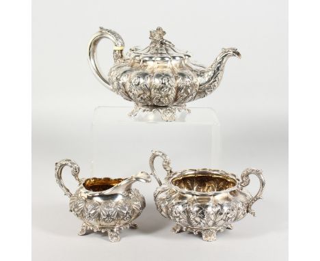 A WILLIAM IV SILVER TEAPOT AND SUGAR BASIN, repousse with acanthus and flowers on shell and acanthus feet, London 1833, and a
