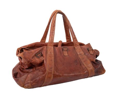 Two vintage brown leather holdall bags. both with brass trim, padlocks (keys not present) and green canvas lining, largest 70
