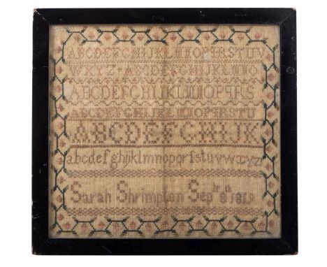 A needlework sampler by Sarah Shrimpton dated 1819. The sampler showing letters of the alphabet in various fonts and sizes wi