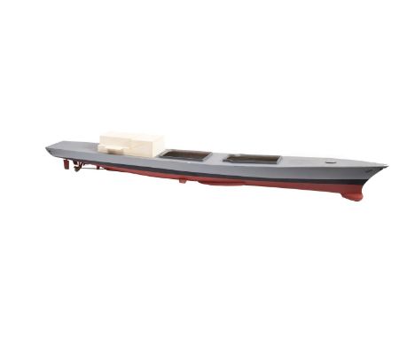 A part complete scale model of a destroyer. Having a fibreglass hull and wooden deck painted in grey with a red keel, fitted 