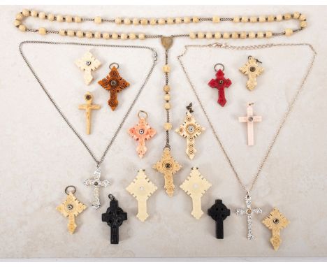 A collection of Stanhopes in the form of crucifixes. Comprising wood, bone and plastic examples in a range of sizes showing a