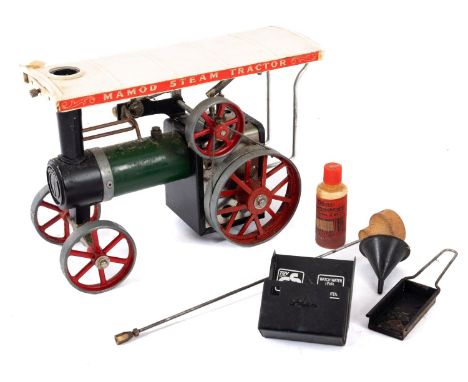 A Mamod live steam traction engine. In green with black trim and red wheels, complete with burner pan, unboxed. 