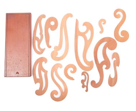 A set of wooden French drawing curves in a mahogany box. A good range of curves showing light use, the box with sliding lid, 