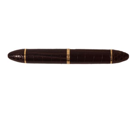 Louis Vuitton. An exotic brown leather Louis Vuitton fountain pen, with gilt clip, '750' 'LV' stamped to the nib, plunger fil
