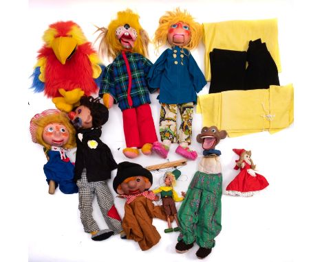 A collection of wooden ventriloquist puppets. In the Pelham puppet style having painted faces and wire operated mouths, inclu