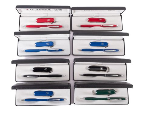 A collection of eight Cross Victorinox cased sets. The sets comprising ballpoint pen and Swiss army knife in a range of colou
