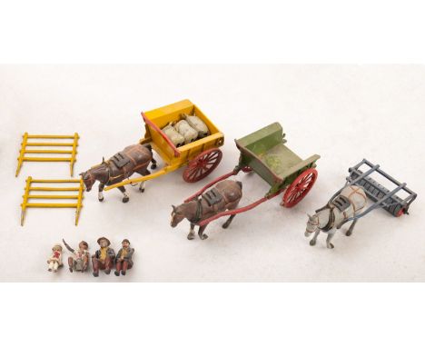 Three Britains Home Farm Series horse drawn vehicles. Comprising a Horse Roller no. 9F, boxed, plus two horse and carts notin