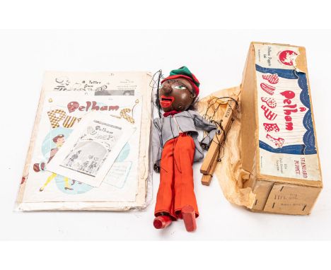 A Pelham puppet, 'Minstrel', with original box and paperwork. Some damage. These items are listed on the basis they are illus