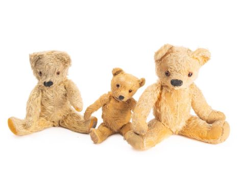 A collection of three teddy bears. Comprising one Chad Valley bear with label to the foot and two others, max height 43cm.