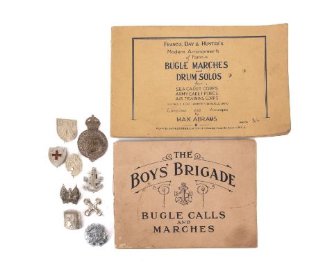 A small group of Boy's Brigade memorabilia. Comprising badges, bugle calls books and a wooden staff 150cm long. 