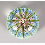 A FRENCH MILLEFIORI PAPERWEIGHT. 2.75ins diameter.