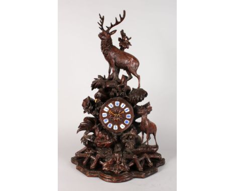 A VERY GOOD BLACK FOREST CARVED WOOD CLOCK, wood brass movement, stamped P R 1733, striking on a single bell with unusual car