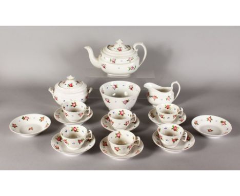 AN ENGLISH TEA SET, sprigged with pink roses, comprising teapot, sucrier, milk jug, six cups and eight saucers.