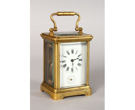 A MINIATURE BRASS ALARM CARRIAGE CLOCK, white porcelain dial, black enamel numerals and hands, in a leather carrying case. 3i