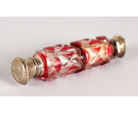 A VICTORIAN DOUBLE ENDED RUBY GLASS SCENT BOTTLE with silver top.  4.5ins long.