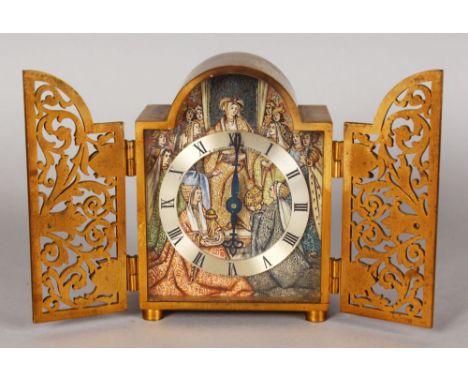 A SUPERB SMALL GILT METAL CLOCK by GUBELIN, LUCERNE, with a pair of fretwork doors, opening to reveal a silvered dial and pai