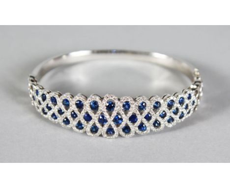 AN 18CT WHITE GOLD, SAPPHIRE AND DIAMOND BANGLE of 2.8cts approx.