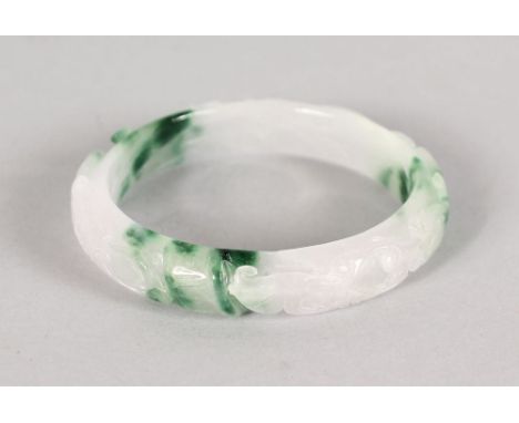AN ENGRAVED JADE BANGLE.